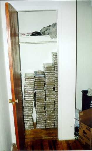 Image - Closet stacked with cocaine.