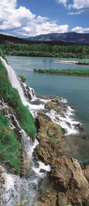 Scenic shot of waterfalls into lake