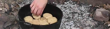 Cooking bisquits in a Dutch oven.