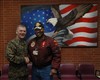 Marine Corps Gen. James E. Cartwright, vice chairman of the Joint Chiefs of Staff, poses for a photo with a volunteer at the McGuire Veterans Affairs Medical Center in Richmond, Va., Jan. 24, 2008. 