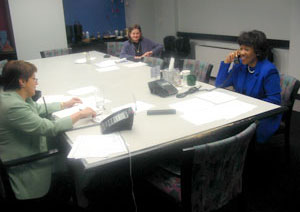 Photo of Dr. Suzanne Haynes and Mrs. Deloris Jordan taking calls on the radio