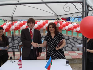 Hijran Hajiyeva and Geof Giacomini gave congratulatory speeches and signed handover documents at the event