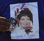 During his Sept. 7, 2007, visit to the Pentagon, William Fields displays his shirt bearing a photo of his wife, Amelia V. Fields who died in the September 11, 2001, terrorist attack against the Pentagon. Defense Dept. photo by Petty Officer 2nd Class Molly A. Burgess, U.S. Navy.