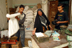 A widow with a family of 4 receives rations as part of a World Food Program that provides basic commodities to the needy in Southern Iraq. The local agent and his family service 168 families (897 people) from the supplies stored in their home. USAID supports the program.