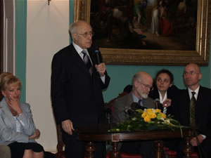 USAID/Russia Mission Director Terry Myers (right) looks on as Maestro Rostropovich speaks at the close-out celebration