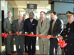 On hand to cut the ribbon at the Target Chicago Exhibit are (left to right): Frank Whittaker NBC 5, Peter Bensinger DEA Committee Chair, Juan Ochoa Navy Pier, Cortez Trotter City of Chicago, Gary Olenkiewicz DEA Chicago, David Weisz Motorola, Phil Kline Chicago Police Superintendent.