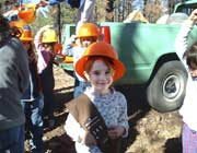 [Photograph]: Forest Service employee working with children.