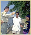 Photo of a Forest Service employee helping some  vacationers.