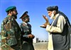 A local elder talks with representatives from the Afghan National Army and National police while waiting for the opening ceremony for a new ANA hospital, Dec. 15, 2007. The $5 million facility in Kandahar provides a wide array of health care, including a pharmacy, dental clinic, eye care, X-ray and ultrasound services for the soldiers of the ANA’s 205th Corps. It will also serve as a trauma center and will expand in late 2008 from 50 to 100 beds.
