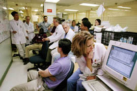 Doctors at a hospital get briefed.