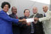 Congresswoman Watson, Postmaster James Smith, District Manager William Almarez, Rev. Robert Robinson (son of Ray Charles), and Joe Adams, CEO of Ray Charles Enterprises, hold the first letter to be sent from the newly renamed Ray Charles Post Office.  The letter is from comedian Bill Cosby and is addressed to former President Bill Clinton.