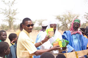 Villager of Niger shows off seeds used to plant in the garden.