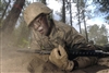 U.S. Air Force Academy basic cadet Michael Provost low crawls down a section of the assault course during training at the U.S. Air Force Academy in Colorado, July 25, 2008. 