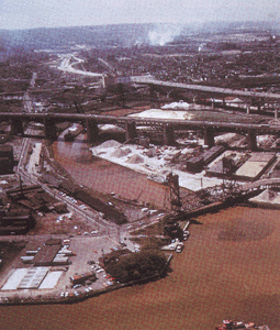 photo: Showing a river winds its way through an industrial city in the basin (ca. 1970)