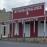 The historic Withers & Spauldings general store painted its original iron oxide red with white trim.