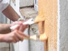 Students of Sveti Sava School in north Mitrovia paint the school wall together with John Boris, Deputy Director for EUR/ACE