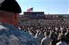 Sgt. Donald Davis, left, listens and watches intently to Vice President Richard B. Cheney, during a welcome back event held on the division’s parade field on Fort Hood, Texas, Feb. 26. Davis is a transportation noncommissioned officer assigned to the 1st Cavalry Division's Company A, 115th Brigade Support Battalion.