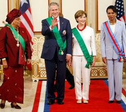 President Bush stands with first lady Laura Bush and Secretary of State Condoleezza Rice as Liberian President Ellen Johnson Sirleaf, left, looks on February 21,2008, at the Executive Mansion in Monrovia, Liberia. [AP photo]