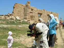 NASA TV on location taping Libyan citizens near the Libyan Coast. In the background, are some of the remnants of the ancient Roman City of Leptis Magna.
