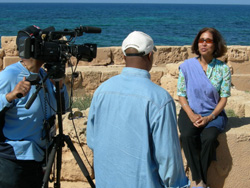 On location filming one of the numerous interviews for the documentary. Madhulika Guhathakurta, NASA program scientist in Washington, was one of the featured scientists in the film. In the background, is the breathtaking Mediterranean Sea.