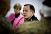 U.S. Navy Adm. Mike Mullen, right, chairman of the Joint Chiefs of Staff, speaks with Marines on Camp Pendleton, Calif., Feb. 19, 2008. Mullen and his wife Deborah, left, visited Marines assigned to the base and were briefed on a new close quarters battle simulator.