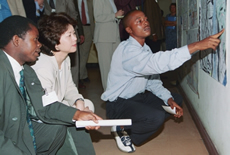 U.S. Secretary of Labor Elaine L. Chao listening to a former child solider describing his experiences at the Belgian Red Cross Center in Kinshasa, Democratic Republic of the Congo.  (DOL Photo) 