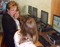 Secretary Gassman (center) and job seekers Samantha Whitney (left) and Janis Torres explore the new JobCenterOfWisconsin.com system.