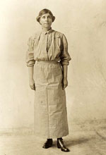 A woman in prison clothes.