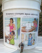 Water jug with drawings and message in Spanish reading 'Bebamos siempre agua saludable.' Photo courtesy of Photoshare.