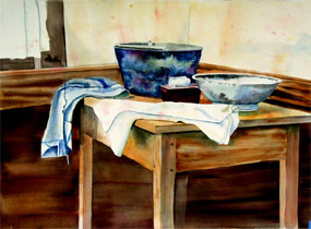 Watercolor painting of two washing bowls and a bar of white soap on a tray, plus two cloths on a wooden table near a window.