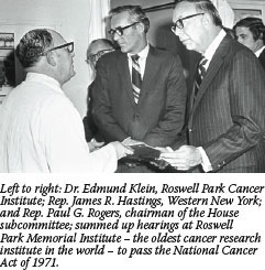 A photograph of Dr. Edmund Klein, of the Roswell Park Cancer Institute, greeting Representative James R. Hastings of Western New York and Representative Paul Rogers, chairman of the House subcommittee, during hearings to pass the National Cancer Act of 1971 at Roswell Park Memorial Institute - the oldest cancer research institute in the world.