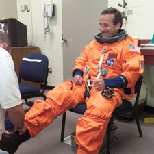 Astronaut Charles Camarda dons a training suit.