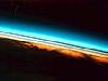 Layers of the upper atmosphere looked at from the edge, shown in colors ranging from red near the earth to blue towards space
