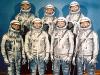 The Mercury Seven astronauts wearing silver-colored spacesuits