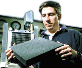 James Klett hold a block of graphite foam
