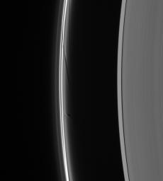 Prometheus dips into the inner F ring at its farthest point from Saturn in its orbit, creating a dark gore and a corresponding bright streamer