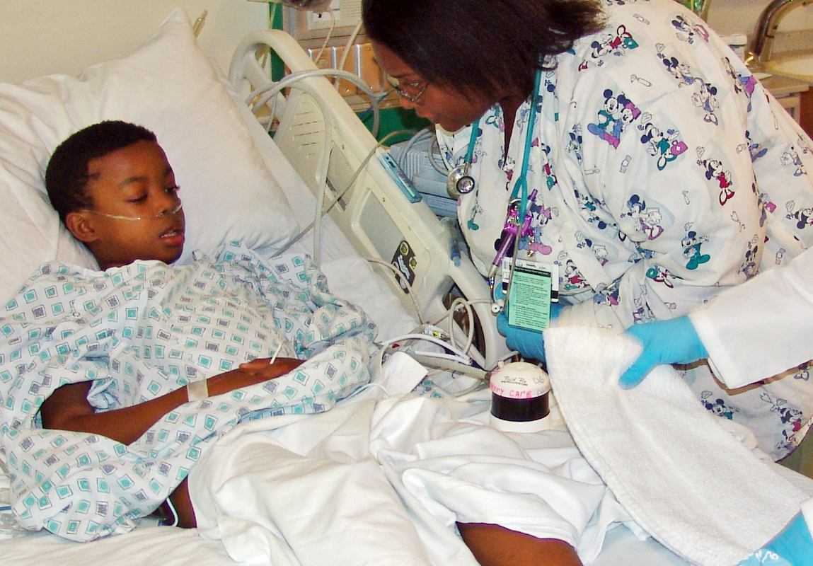 Mohammad Adisa in the Pediatric Intensive Care Unit, being treated for severe malaria.