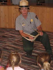 Ranger showing children an antler.