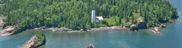 Aerial of the Rock Harbor Lighthouse and the Rock Harbor channel.