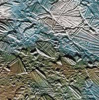 The surface of Europa, a moon of Jupiter, 
        consists mostly of huge blocks of ice that have cracked and shifted about, 
        suggesting that there may be an ocean of liquid water underneath. NASA