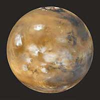 The planet Mars, like Earth, has clouds in its atmosphere and a deposit of ice at its north pole. But unlike Earth, Mars has no liquid water on its surface. The rustlike color of Mars comes from the large amount of iron in the planet's soil.