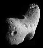 Craters cover the surface of the asteroid Eros. The asteroid is about 21 miles (33 kilometers) long, about 1 1/2 times the length of Manhattan Island.