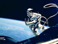 The first U.S. astronaut to walk in space was Edward H. White II on June 3, 1965. A 26-foot (8-meter) cord linked White to the Gemini 4 spacecraft during the spacewalk. He controlled his movements in space by using a handheld rocket gun filled with gas.