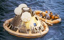 After splashdown, three balloons righted the Apollo 11 spacecraft in the water, and an orange collar helped keep it afloat.