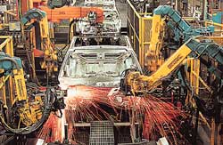 Robots weld car bodies at a manufacturing plant in Wixom. Michigan ranks as the leading U.S. automobile manufacturer.