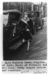 Suzette Dewey, daughter of Charles Dewey, posed beside roadster