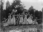 [Eight women and one child(?) performing Greek dance outdoors, Washington, D.C. area]
