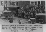 Police raid a gambler's den. Several loads of book makers were taken from the E. St. address by the police