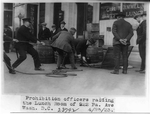 Prohibition officers raiding a lunch room