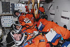 Mission Specialists Mike Foreman, Takao Doi and Garrett Reisman